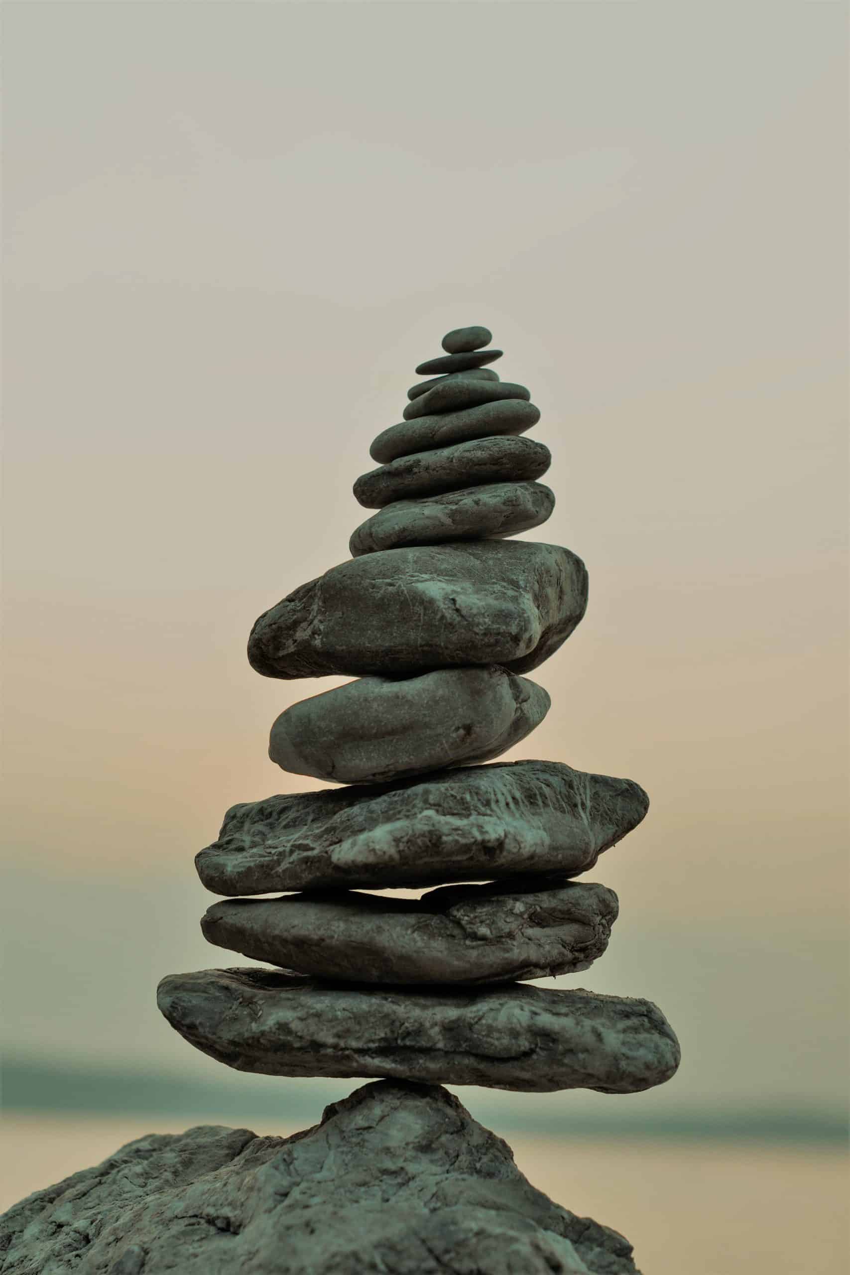 grey pebbles balanced in a tower